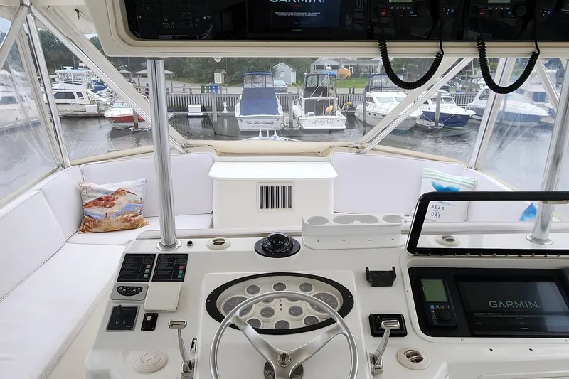 Slide: The Image of Helm of 2001 Ocean Yachts 56 Super Sport with Garmin navigation, docked at marina. - 32
