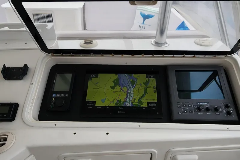 Slide: The Image of Control panel of 2001 Ocean Yachts 56 Super Sport with navigation display. - 35