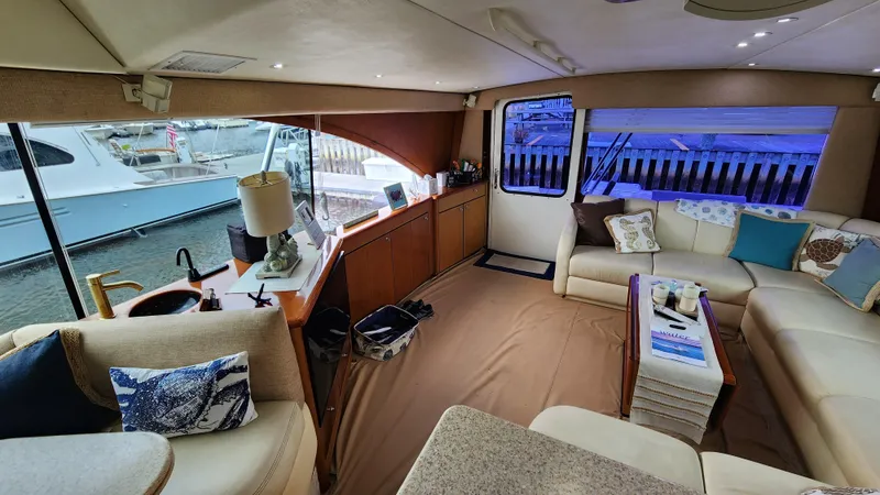 Slide: The Image of Luxurious interior of a 2001 Ocean Yachts 56 Super Sport, featuring elegant seating and decor. - 43