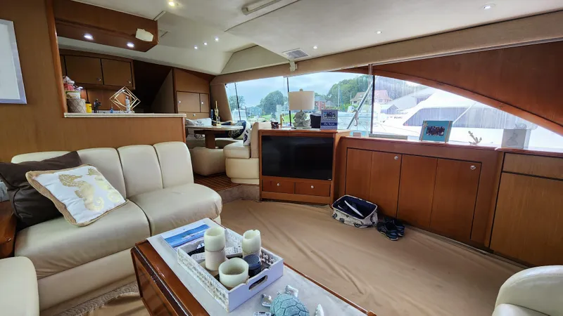 Slide: The Image of Luxurious interior of 2001 Ocean Yachts 56 Super Sport with elegant furnishings and large windows. - 44