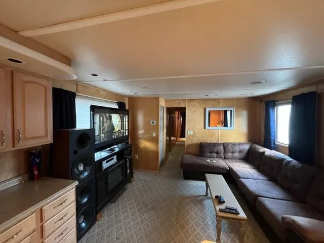 Slide: The Image of Interior of a 1988 Stardust Cruisers houseboat with a cozy living area. - 3