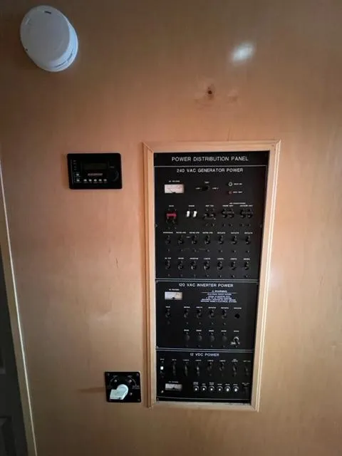 Slide: The Image of 1988 Stardust Cruisers Houseboat power distribution panel. - 6