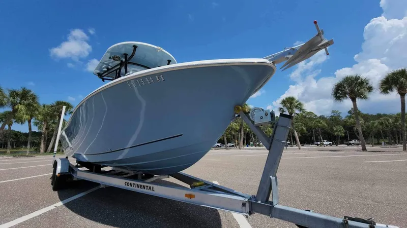 Slide: The Image of 2017 Sea Chaser 24 HFC boat on a Continental trailer in a parking lot. - 13