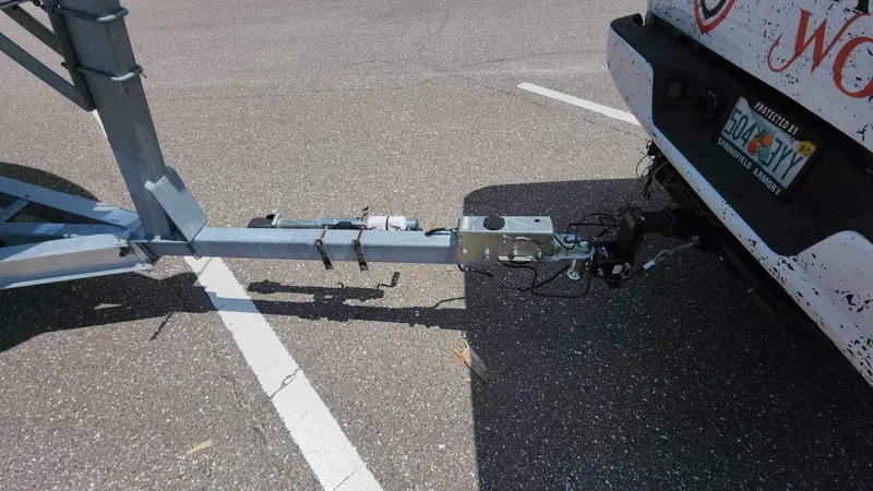 Slide: The Image of Trailer hitch of a 2017 Sea Chaser 24 HFC boat attached to a vehicle. - 14