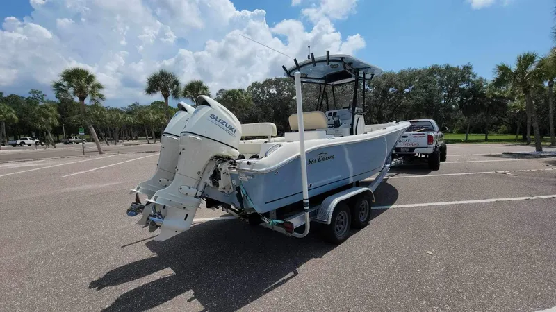 Slide: The Image of 2017 Sea Chaser 24 HFC boat on trailer in parking lot with palm trees. - 20