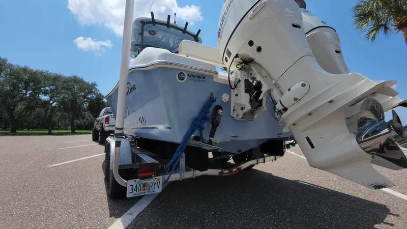 Slide: The Image of 2017 Sea Chaser 24 HFC boat on trailer, rear view with outboard motor. - 22