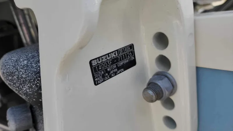 Slide: The Image of Close-up of 2017 Sea Chaser 24 HFC Suzuki motor serial number plate. - 24