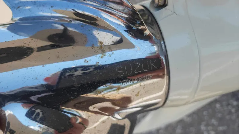 Slide: The Image of Close-up of Suzuki engine part on 2017 Sea Chaser 24 HFC boat. - 26