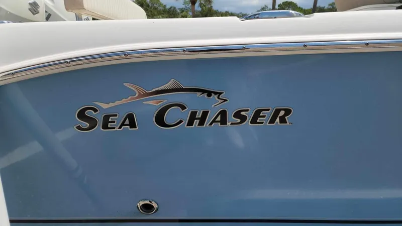 Slide: The Image of 2017 Sea Chaser 24 HFC boat logo on blue hull. - 29