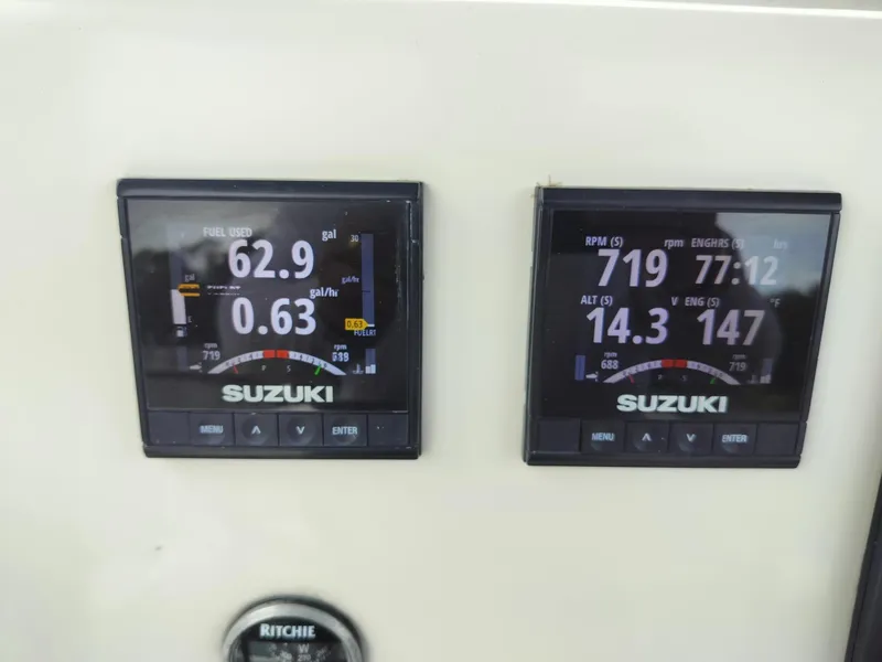 Slide: The Image of Suzuki digital gauges on 2017 Sea Chaser 24 HFC boat dashboard. - 3