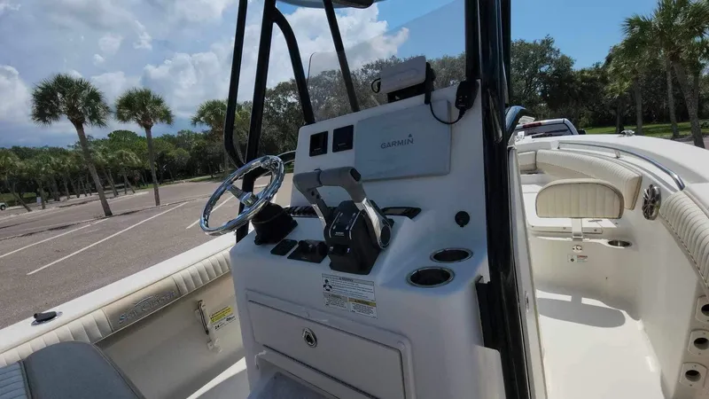 Slide: The Image of 2017 Sea Chaser 24 HFC boat interior with steering console and controls. - 30