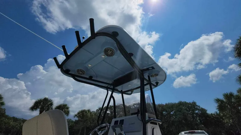 Slide: The Image of 2017 Sea Chaser 24 HFC boat under a bright blue sky with clouds. - 32