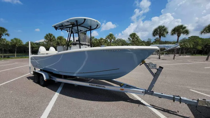Slide: The Image of 2017 Sea Chaser 24 HFC boat on a Continental trailer in a parking lot. - 38