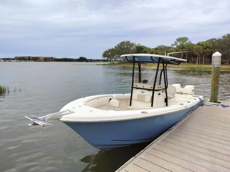 Slide: The Image of 2017 Sea Chaser 24 HFC boat docked by a serene lake. - 40