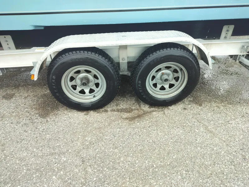 Slide: The Image of 2017 Sea Chaser 24 HFC trailer with dual wheels on wet pavement. - 43