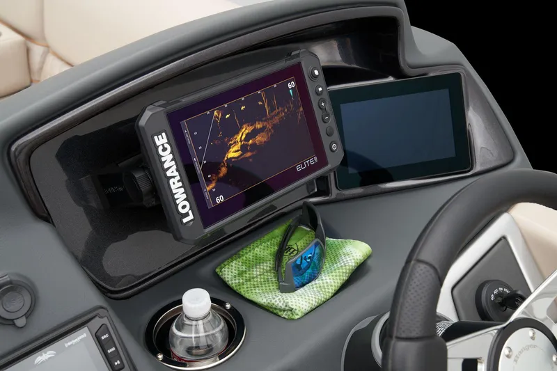 Slide: The Image of Dashboard of 2024 Ranger Reata 220FC with Lowrance Elite fishfinder and sunglasses. - 35