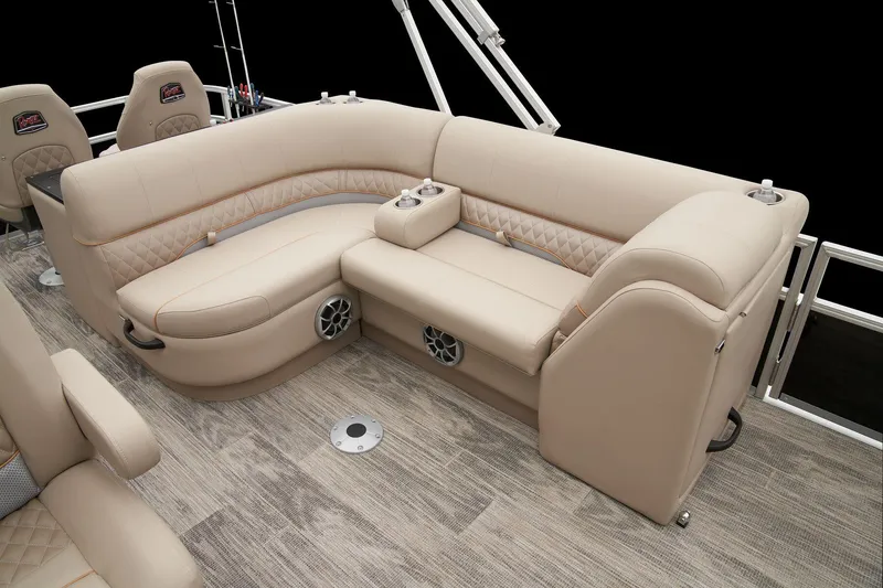 Slide: The Image of 2024 Ranger Reata 220FC boat interior with beige seating and wood flooring. - 41