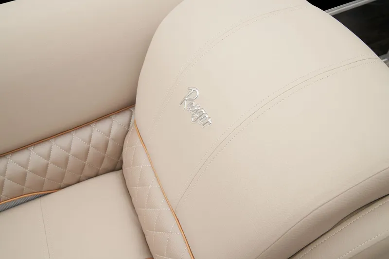 Slide: The Image of 2024 Ranger Reata 220FC beige quilted leather seat with logo. - 49