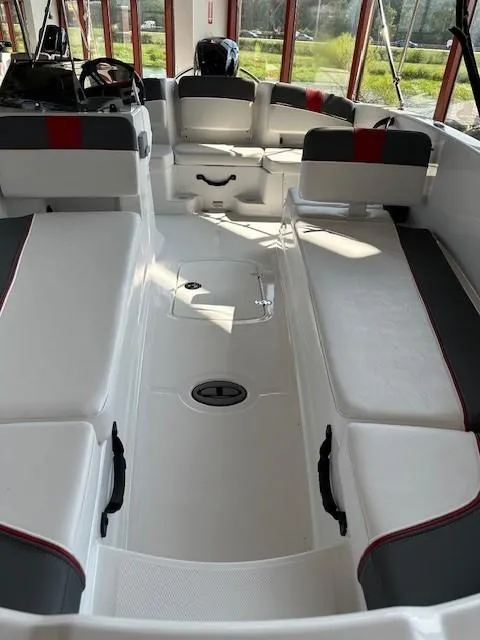 Slide: The Image of 2024 Tahoe T18 boat interior with spacious seating and modern design. - 4