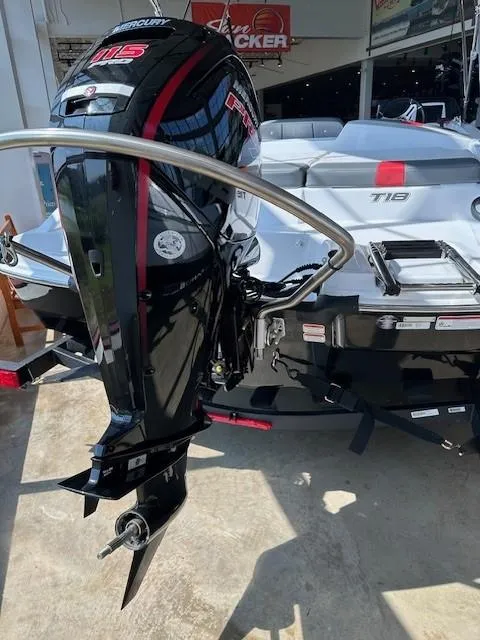 Slide: The Image of 2024 Tahoe T18 boat with powerful outboard motor in showroom. - 5