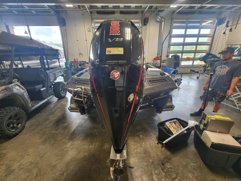 Slide: The Image of 2024 Ranger Z519 boat with V8 engine in a garage. - 6