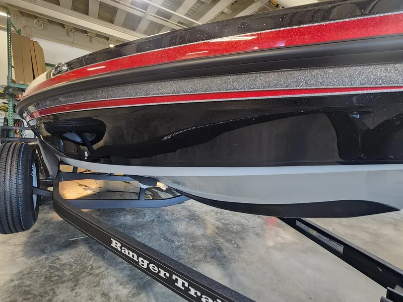 Slide: The Image of 2024 Ranger Z518 boat on Ranger trailer in a garage. - 2