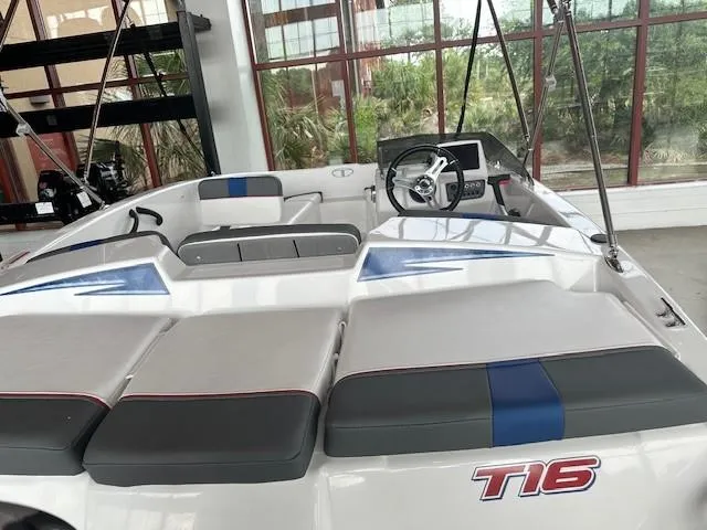 Slide: The Image of 2024 Tahoe T16 boat interior with seating and steering wheel. - 1