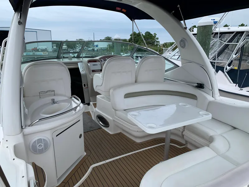 Slide: The Image of 2006 Sea Ray 340 Sundancer boat interior with seating and table. - 13