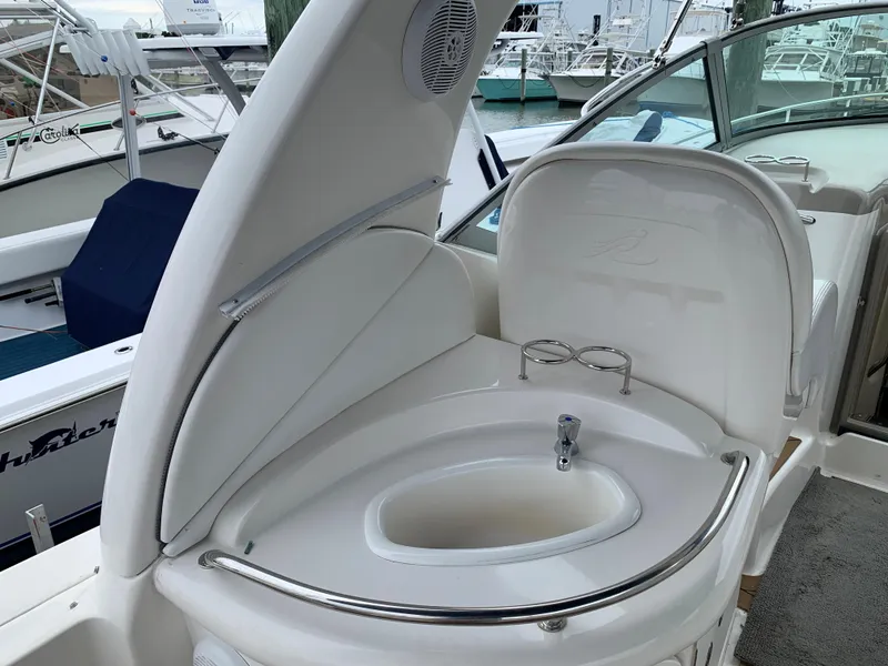 Slide: The Image of 2006 Sea Ray 340 Sundancer boat sink and cup holders on deck. - 16
