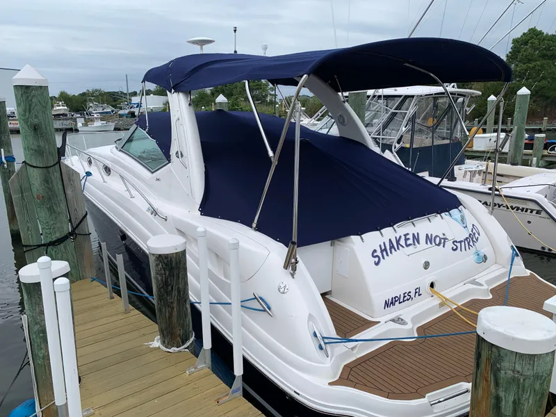 Slide: The Image of 2006 Sea Ray 340 Sundancer docked, blue canopy, Shaken Not Stirred in Naples, FL. - 2