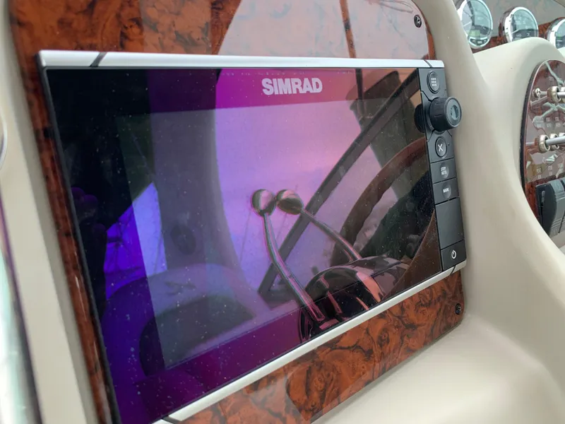 Slide: The Image of Simrad navigation system on 2006 Sea Ray 340 Sundancer boat dashboard. - 23