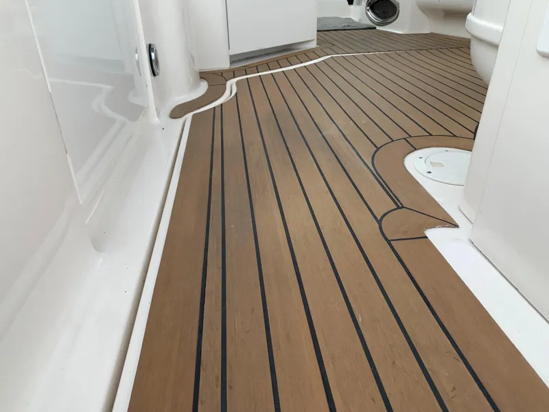 Slide: The Image of Teak deck of a 2006 Sea Ray 340 Sundancer boat. - 25