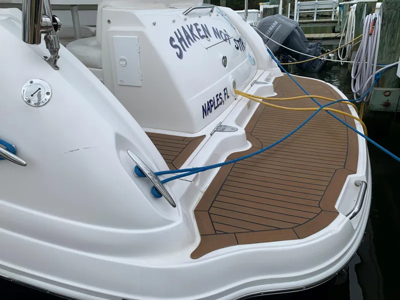 Slide: The Image of 2006 Sea Ray 340 Sundancer docked, rear view with Naples, FL registration. - 3