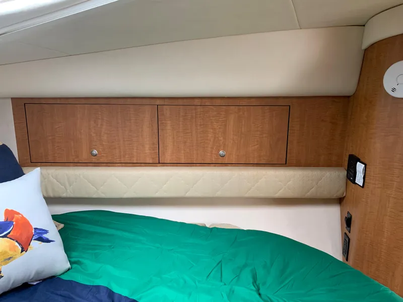 Slide: The Image of Interior cabin of 2006 Sea Ray 340 Sundancer with wooden storage cabinets. - 35
