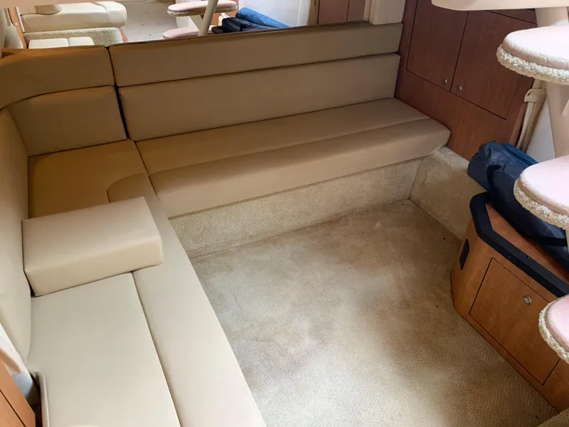 Slide: The Image of Interior seating area of a 2006 Sea Ray 340 Sundancer yacht with beige upholstery. - 37