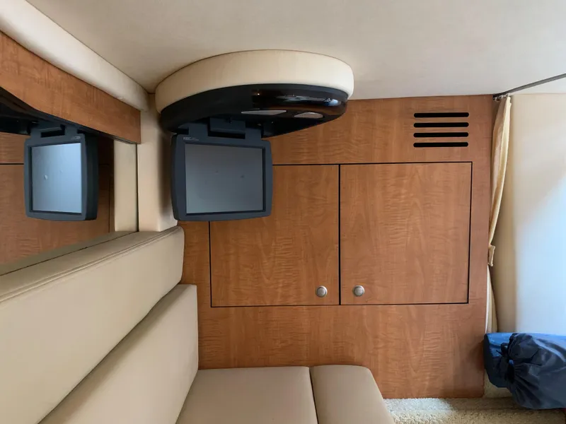 Slide: The Image of Interior of 2006 Sea Ray 340 Sundancer with TV and wooden cabinetry. - 38