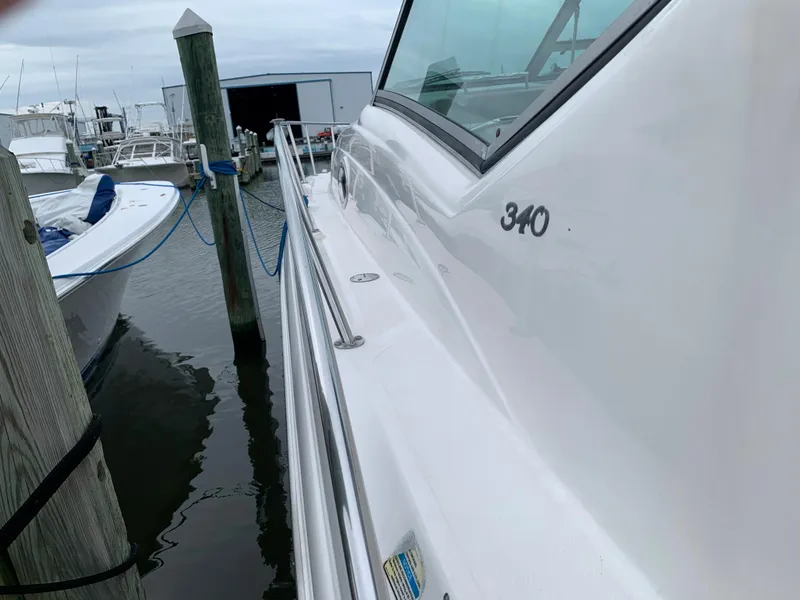 Slide: The Image of 2006 Sea Ray 340 Sundancer docked at a marina. - 4