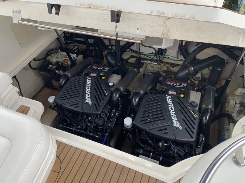 Slide: The Image of 2006 Sea Ray 340 Sundancer engine compartment with twin Mercury engines. - 41
