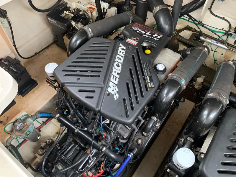 Slide: The Image of 2006 Sea Ray 340 Sundancer engine compartment with Mercury engine. - 42