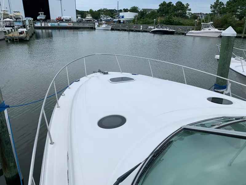 Slide: The Image of 2006 Sea Ray 340 Sundancer docked at a marina. - 5