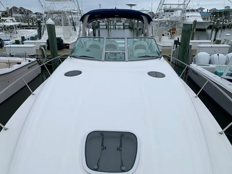 Slide: The Image of 2006 Sea Ray 340 Sundancer docked at a marina. - 7