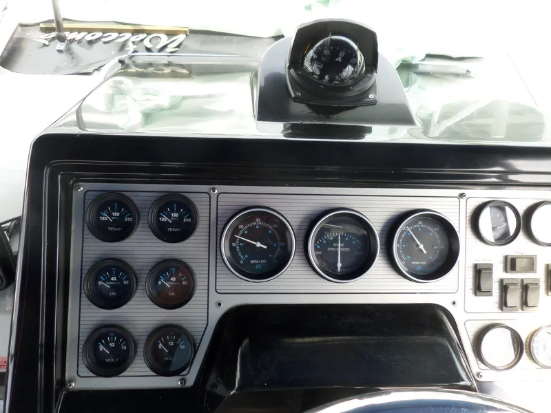Slide: The Image of Dashboard of a 1986 Wellcraft Monte Carlo 2800 boat with gauges and compass. - 20