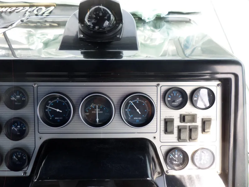 Slide: The Image of 1986 Wellcraft Monte Carlo 2800 dashboard with gauges and compass. - 21