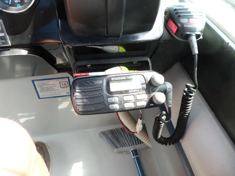 Slide: The Image of 1986 Wellcraft Monte Carlo 2800 boat dashboard with radio and microphone. - 24