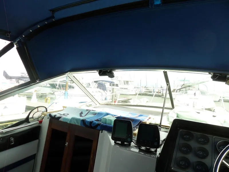 Slide: The Image of Interior view of 1986 Wellcraft Monte Carlo 2800 boat cockpit with navigation equipment. - 27
