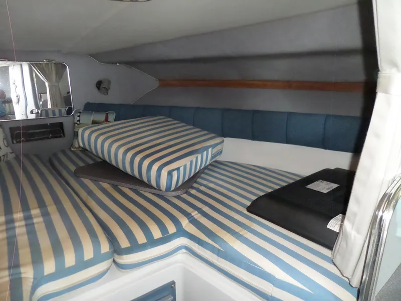 Slide: The Image of Interior cabin of 1986 Wellcraft Monte Carlo 2800 with striped cushions. - 35