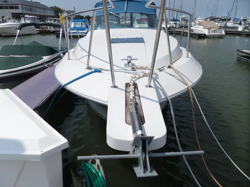 Slide: The Image of 1986 Wellcraft Monte Carlo 2800 docked at a marina. - 4