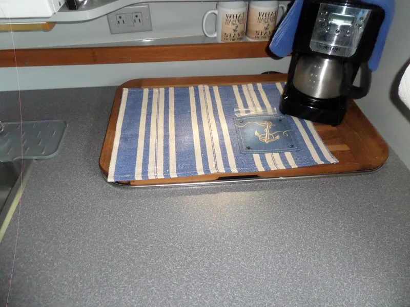 Slide: The Image of 1986 Wellcraft Monte Carlo 2800 boat kitchen with coffee maker and striped mat. - 41