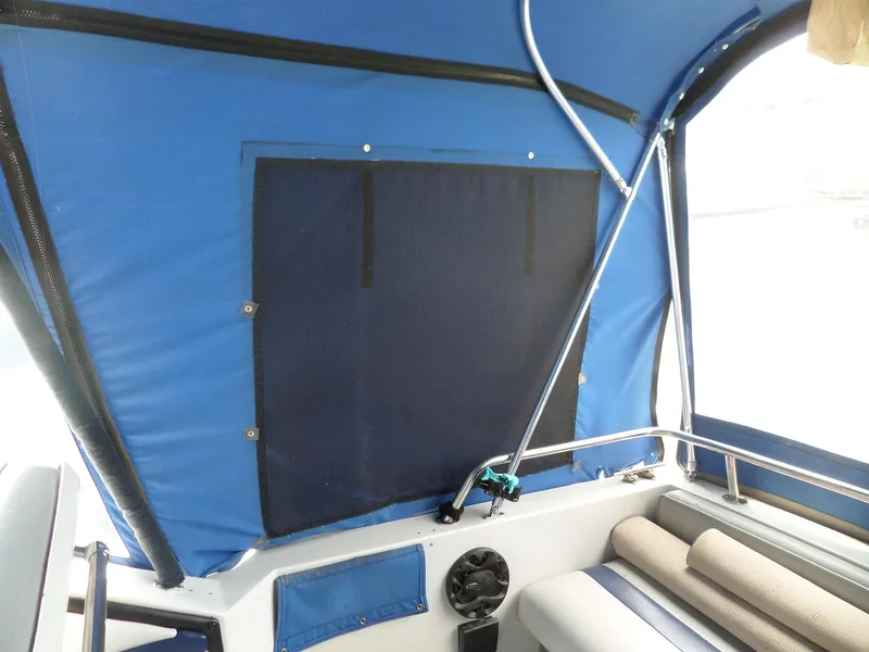Slide: The Image of Interior view of 1986 Wellcraft Monte Carlo 2800 boat with blue canopy. - 8