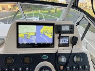 Slide: The Image of 2005 Grady-White Sailfish 282 boat dashboard with navigation system and controls. - 10